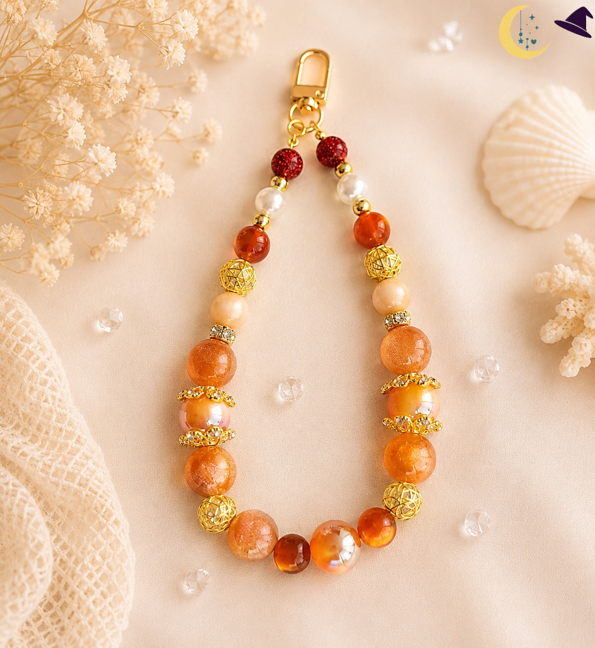 Porte-clé bijou orange doré – chaleur lumineuse et élégance artisanale